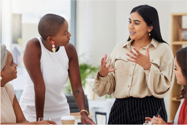 Colleagues in conversation in an office