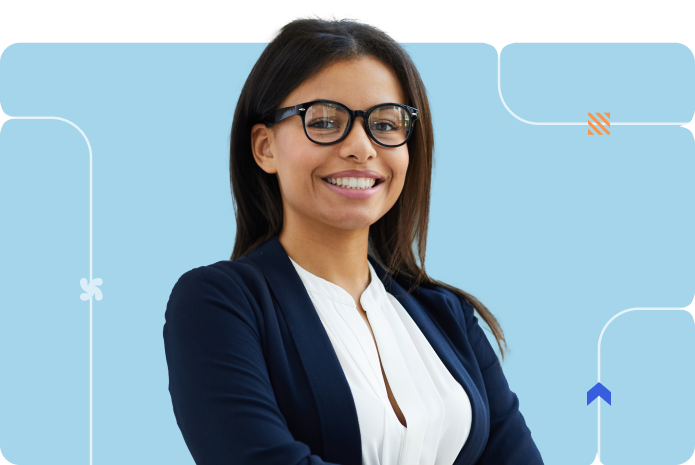 A woman in a formal outfit and glasses smiles against a blue background