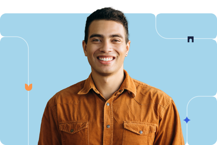 A person poses in an orange button-up in front of a blue background