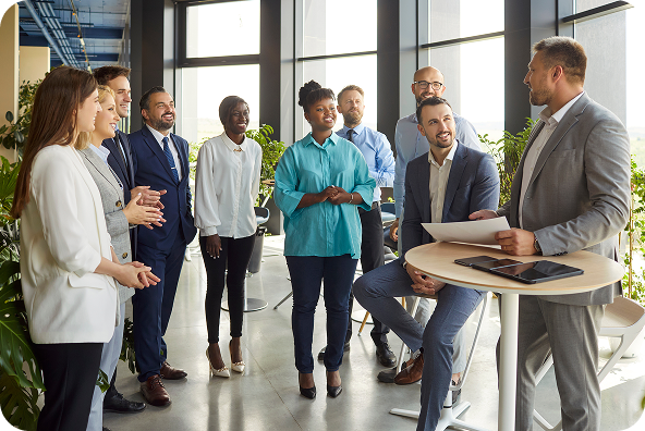 Business professionals listening to a Scrum Alliance member speak