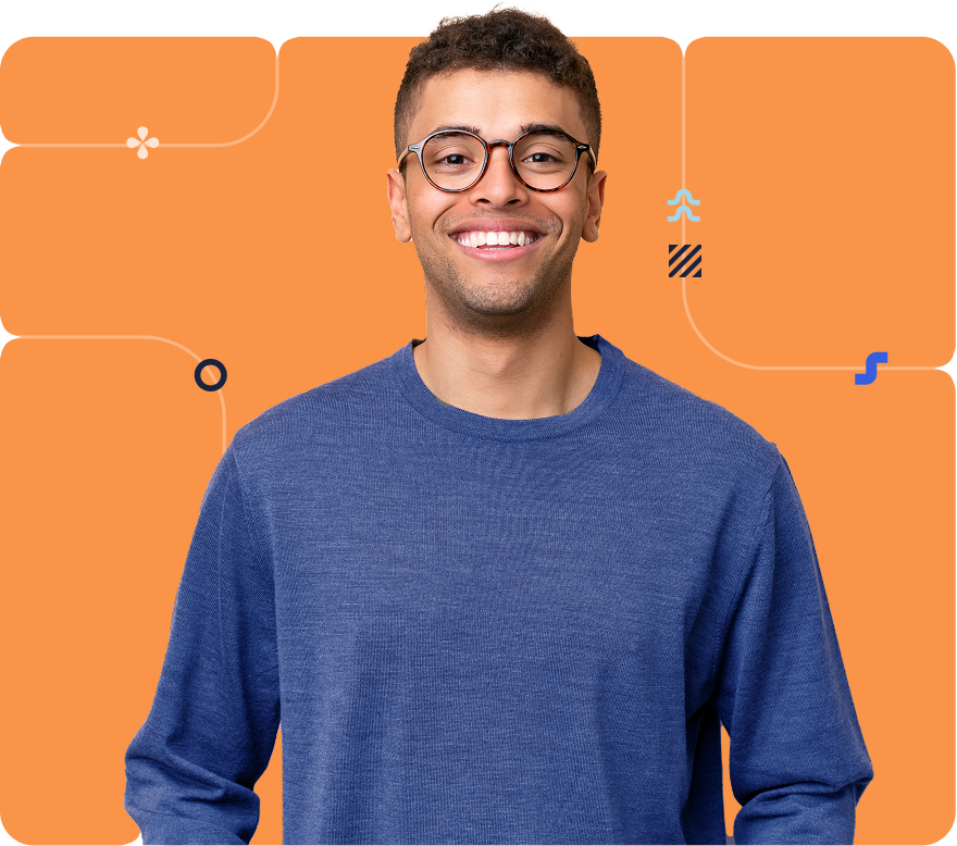 A person in a blue sweater in front of an orange background
