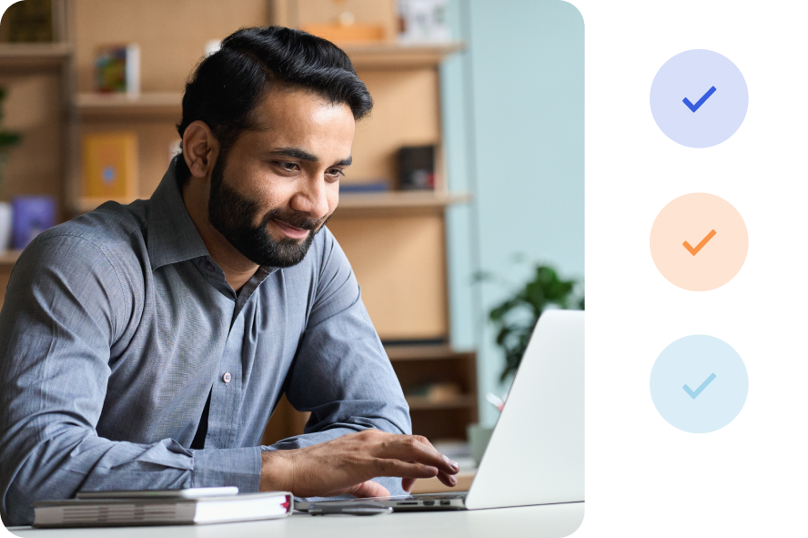 Person smiling using a laptop